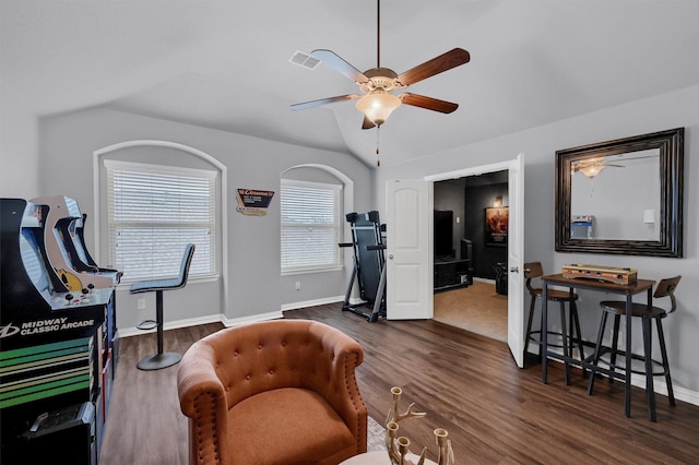 interior space with lofted ceiling, dark hardwood / wood-style floors, and ceiling fan