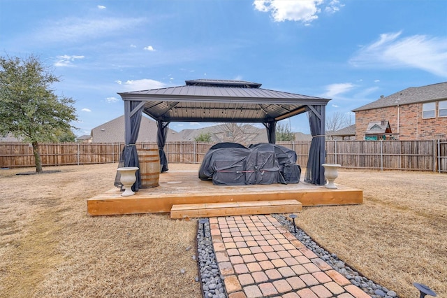 exterior space with a wooden deck and a gazebo