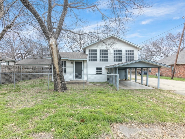 split level home with a front yard and a carport