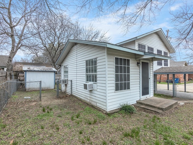 exterior space featuring cooling unit and an outbuilding