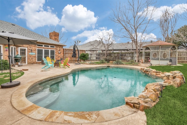 view of swimming pool with a gazebo, a grill, and a patio