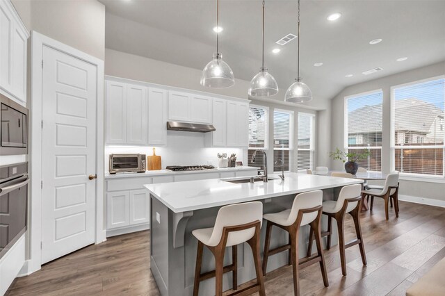 home office featuring baseboards and wood finished floors