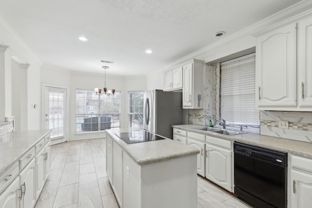 kitchen with white cabinetry, sink, and black appliances