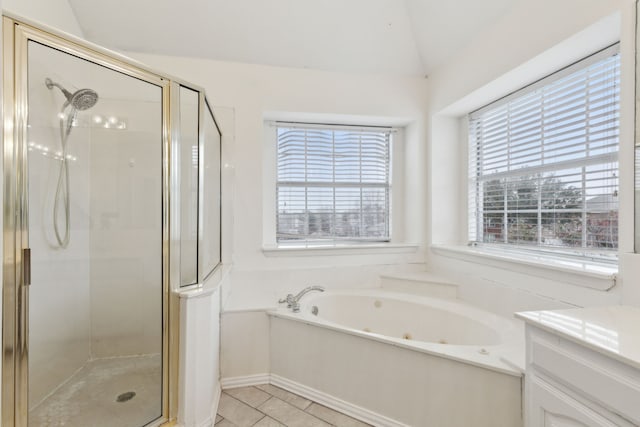 bathroom featuring plus walk in shower, lofted ceiling, vanity, and tile patterned floors