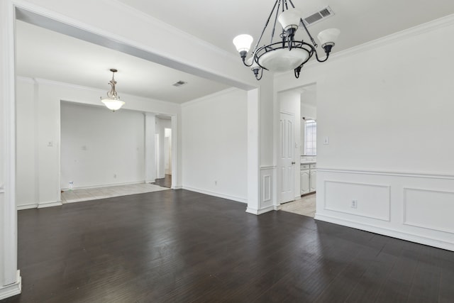 interior space with hardwood / wood-style flooring and ornamental molding