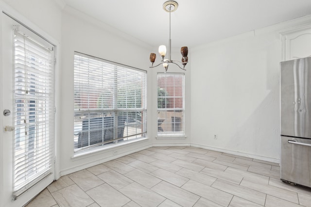 unfurnished dining area featuring a notable chandelier