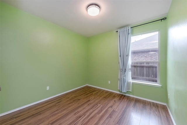 unfurnished room featuring hardwood / wood-style floors