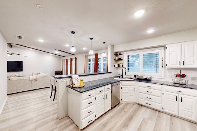 6808 Westglen Dr, Fort Worth, TX 76133 - kitchen with pendant lighting, light hardwood / wood-style flooring, white cabinetry, stainless steel dishwasher, and kitchen peninsula