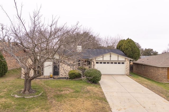 view of front of house with a garage and a front lawn