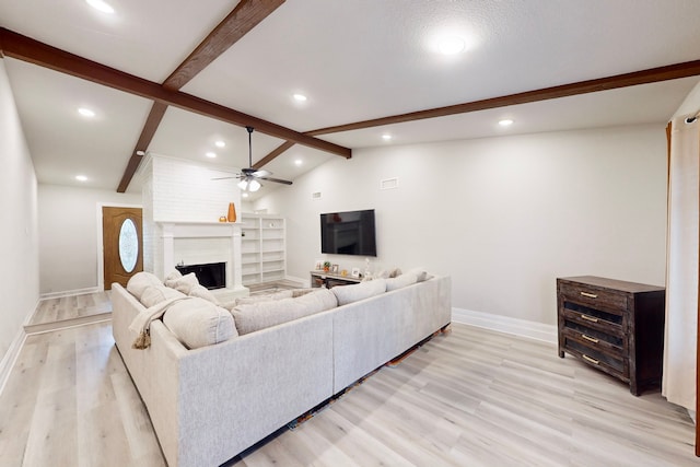 6808 Westglen Dr, Fort Worth, TX 76133 - living room with ceiling fan, a fireplace, light hardwood / wood-style floors, and vaulted ceiling with beams