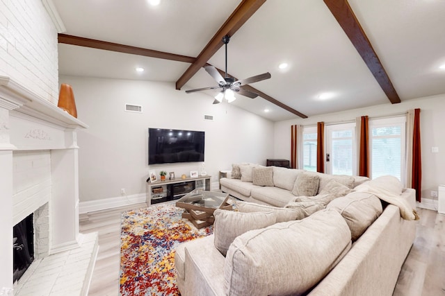 6808 Westglen Dr, Fort Worth, TX 76133 - living room with ceiling fan, a fireplace, lofted ceiling with beams, and light wood-type flooring