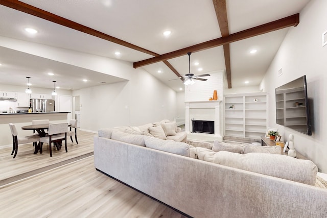 6808 Westglen Dr, Fort Worth, TX 76133 - living room with ceiling fan, a fireplace, lofted ceiling with beams, and light wood-type flooring
