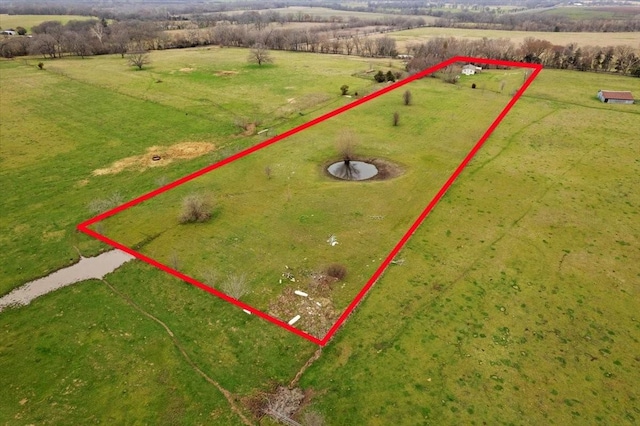 birds eye view of property featuring a rural view