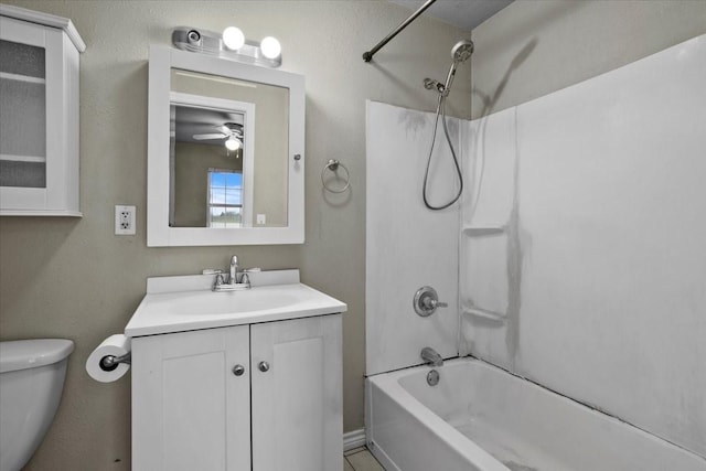 full bathroom featuring bathing tub / shower combination, vanity, and toilet