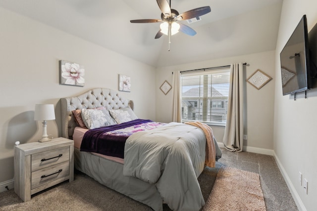 carpeted bedroom featuring baseboards, lofted ceiling, and a ceiling fan