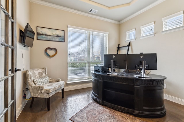 office space with dark wood-type flooring, baseboards, visible vents, and ornamental molding