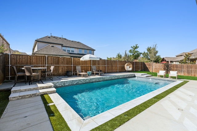 view of pool featuring a patio area