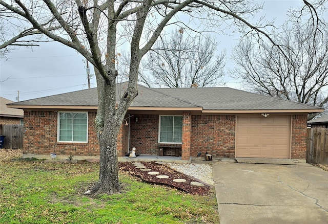 ranch-style house featuring a garage and a front lawn