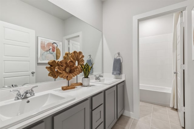 bathroom featuring shower / tub combo with curtain, tile patterned floors, and vanity