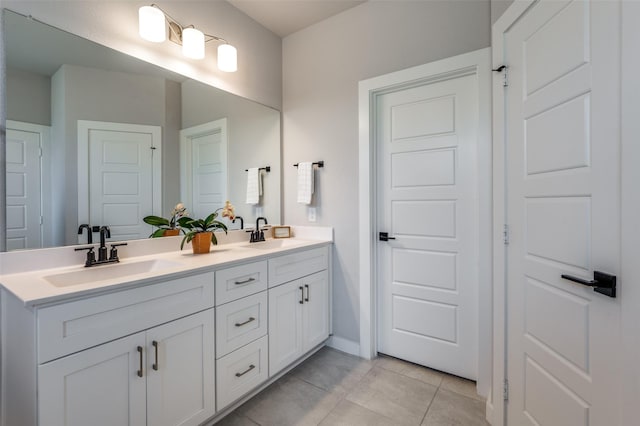 bathroom with vanity and tile patterned flooring