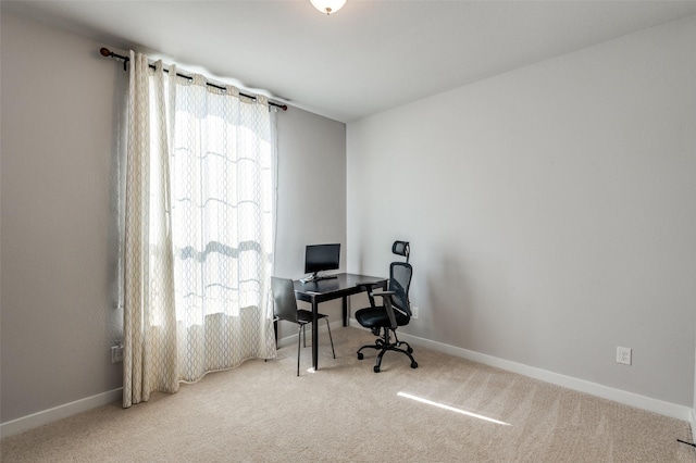 carpeted office space with a healthy amount of sunlight