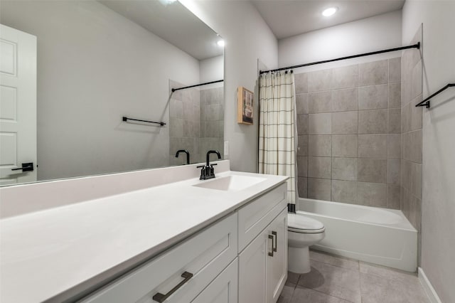 full bathroom featuring tile patterned floors, vanity, toilet, and shower / tub combo