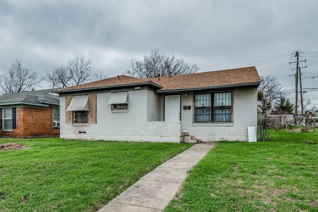 view of front of home with a front lawn