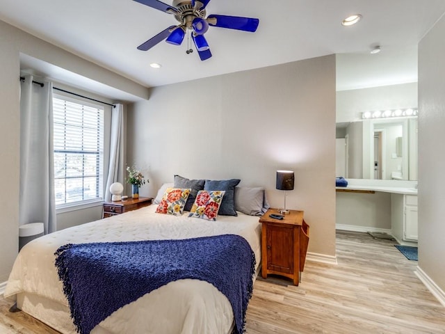 bedroom featuring recessed lighting, light wood-style flooring, and baseboards