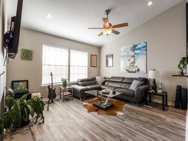 living area featuring lofted ceiling, recessed lighting, ceiling fan, wood finished floors, and baseboards