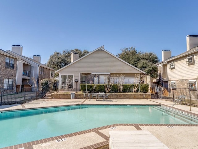 community pool featuring fence