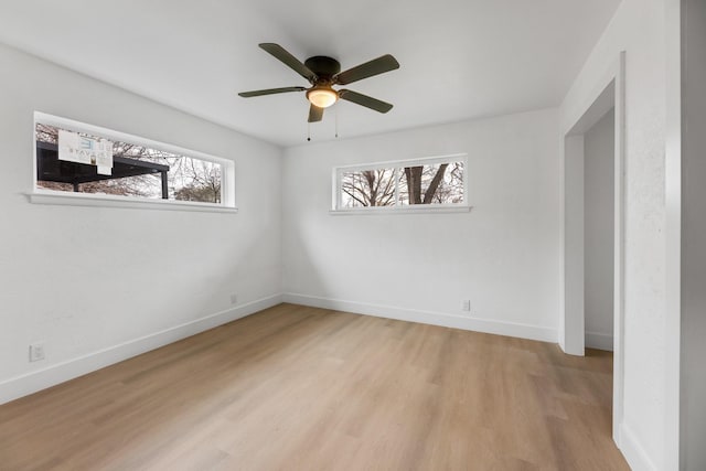 unfurnished room featuring ceiling fan and light hardwood / wood-style flooring