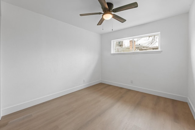 unfurnished room featuring hardwood / wood-style floors and ceiling fan