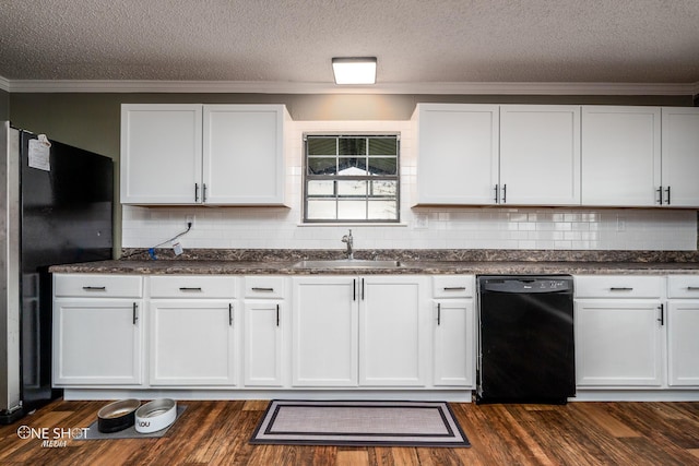 kitchen with sink, white cabinets, black dishwasher, and refrigerator