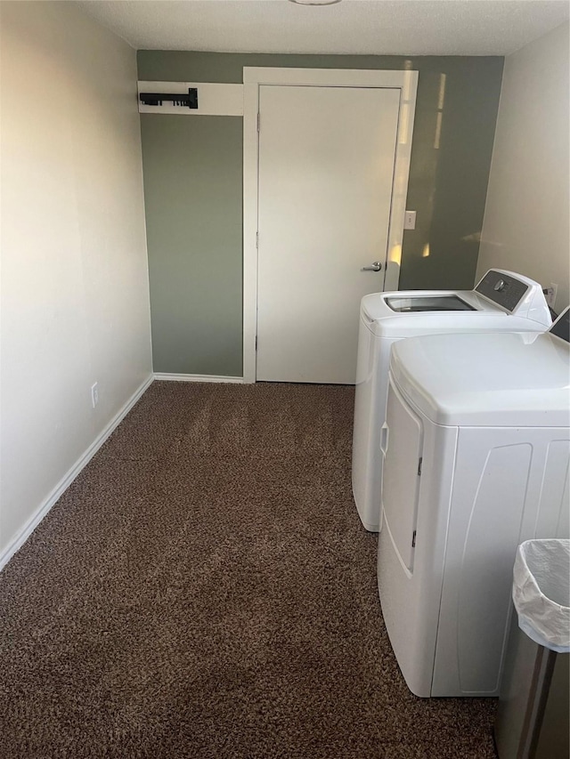 clothes washing area featuring independent washer and dryer and dark carpet