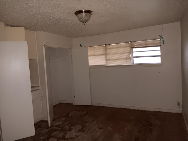 empty room with a textured ceiling