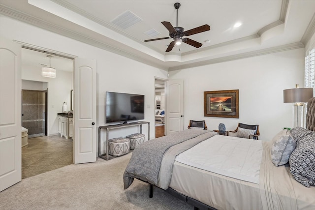 carpeted bedroom with ceiling fan, ornamental molding, and a raised ceiling