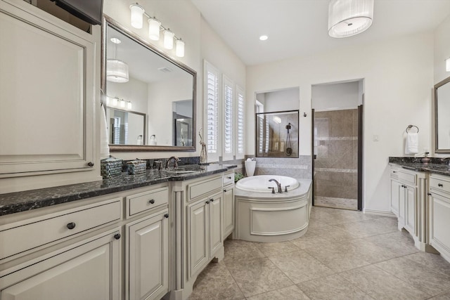 bathroom featuring vanity, tile patterned floors, and independent shower and bath