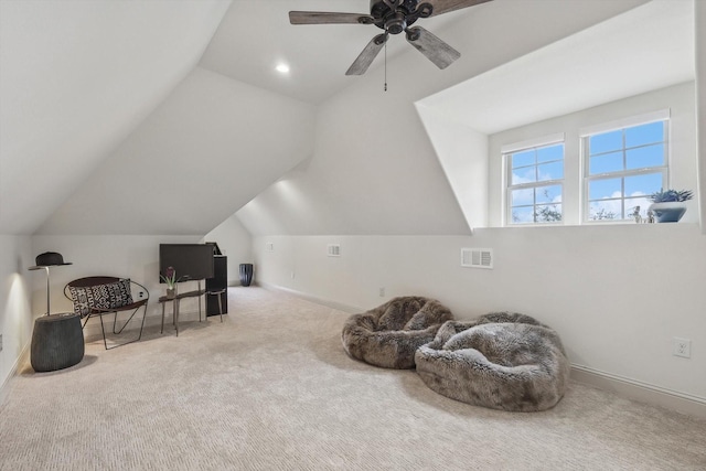 living area featuring lofted ceiling, light carpet, and ceiling fan