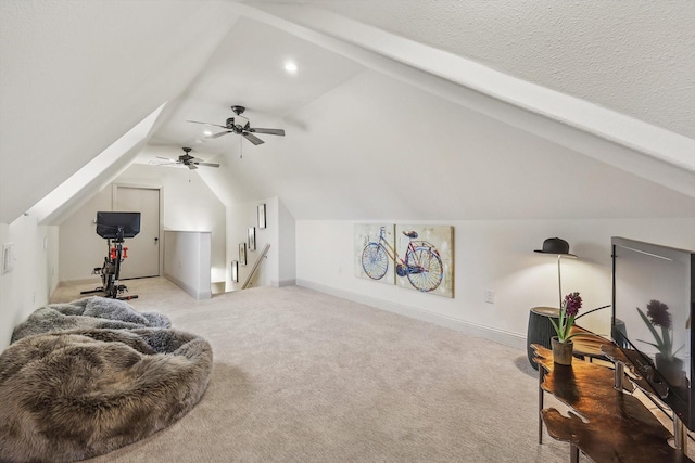 bonus room with lofted ceiling and light carpet