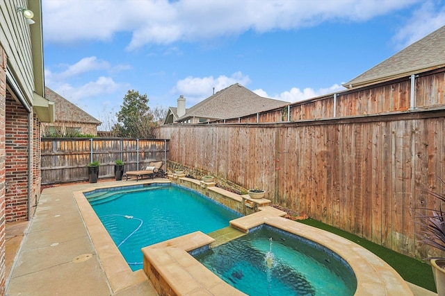 view of pool with an in ground hot tub