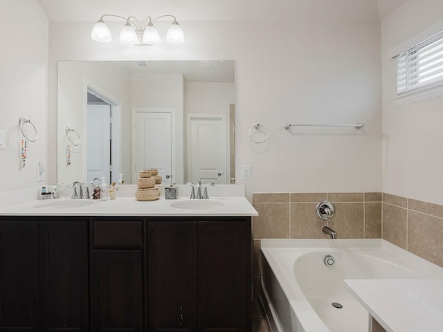 full bathroom featuring a garden tub, a sink, and double vanity