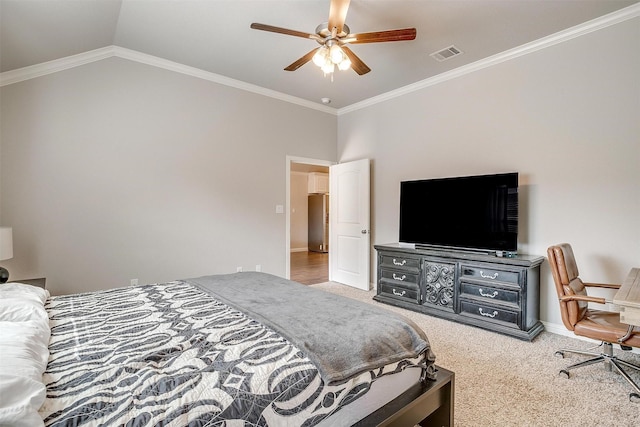 carpeted bedroom featuring crown molding, ceiling fan, and vaulted ceiling