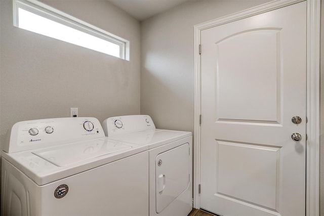 washroom featuring washing machine and dryer