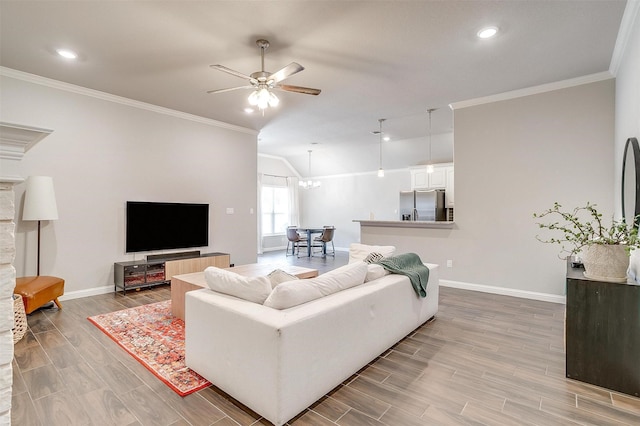 living room with crown molding, vaulted ceiling, and ceiling fan