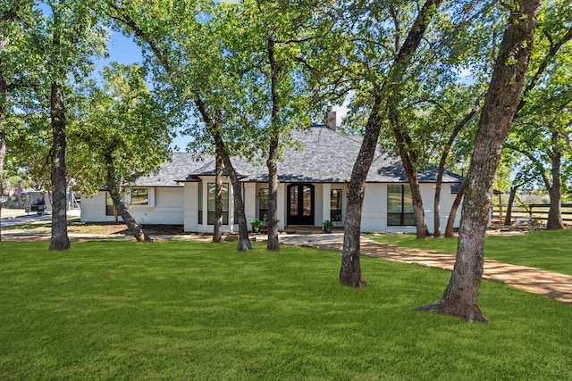 4800 Lusk Ln, Flower Mound, TX 75028 - view of front of property with a front lawn, french doors, a shingled roof, and a chimney
