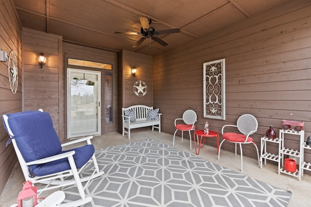 view of patio with ceiling fan and a porch