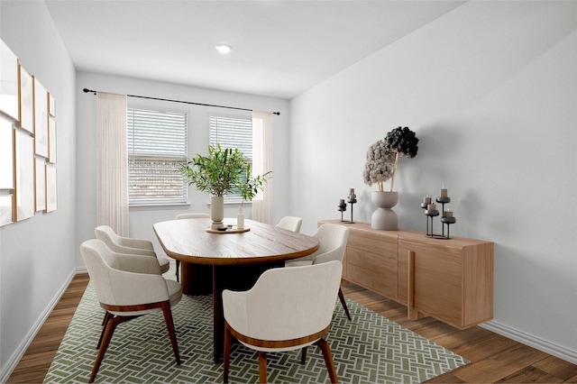 dining space featuring dark hardwood / wood-style flooring