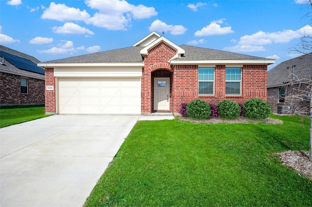 view of front of property with a garage and a front yard