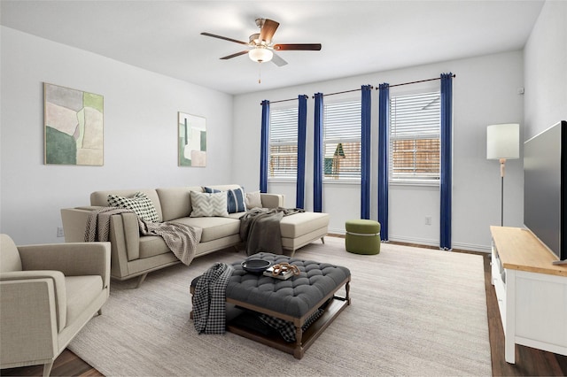 living room with ceiling fan and wood-type flooring