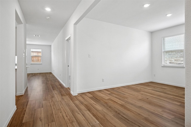 unfurnished room with light wood-type flooring